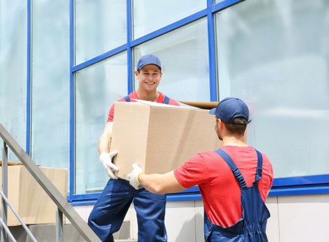 Careful loading of household items for house removals in Mill Hill