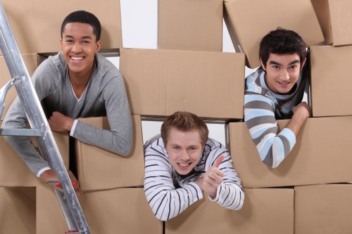 Packed moving boxes and household items ready for a Mill Hill relocation