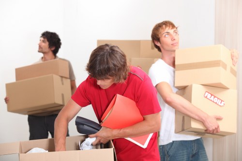 Local moving team preparing items for transport in Mill Hill