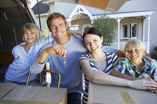 Professional mover handling household items for a Mill Hill move