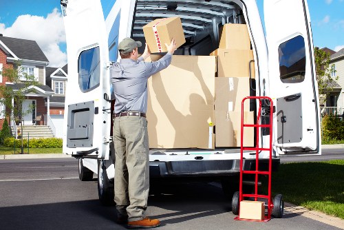 Packed office boxes and furniture ready for a Mill Hill business move
