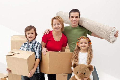 Packed boxes and furniture prepared for a Mill Hill removal
