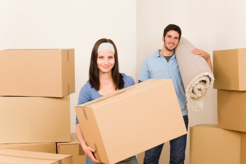 Local removals crew handling office equipment during a commercial move