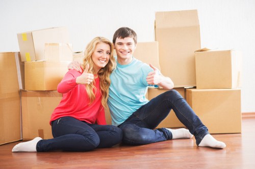 Packed moving boxes and furniture in a Mill Hill home